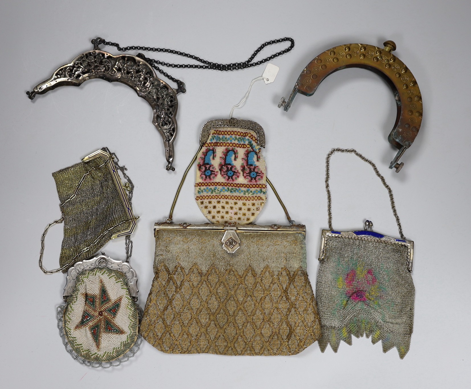 Two chain mail Edwardian handbags with enamelled frames, two 19th century beaded purses and a bag with ornate metal frames and two 20th century large metal bag frames (6)